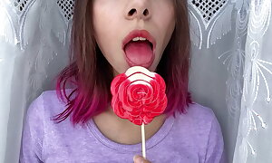 Unruly stepsister sucks a sugar-plum and displays her long hot sexy tongue