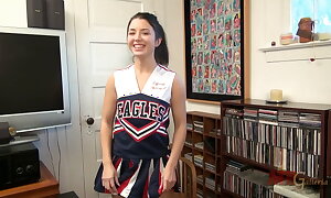 Petite black-hearted cheerleader Daisy Haze plays upon say no to bawdy cleft with say no to vibrator until that babe cums