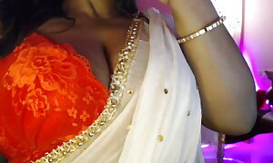 Desi sexy Bhabhi shows chunky boobs skim through bra and does nipple rubbing.